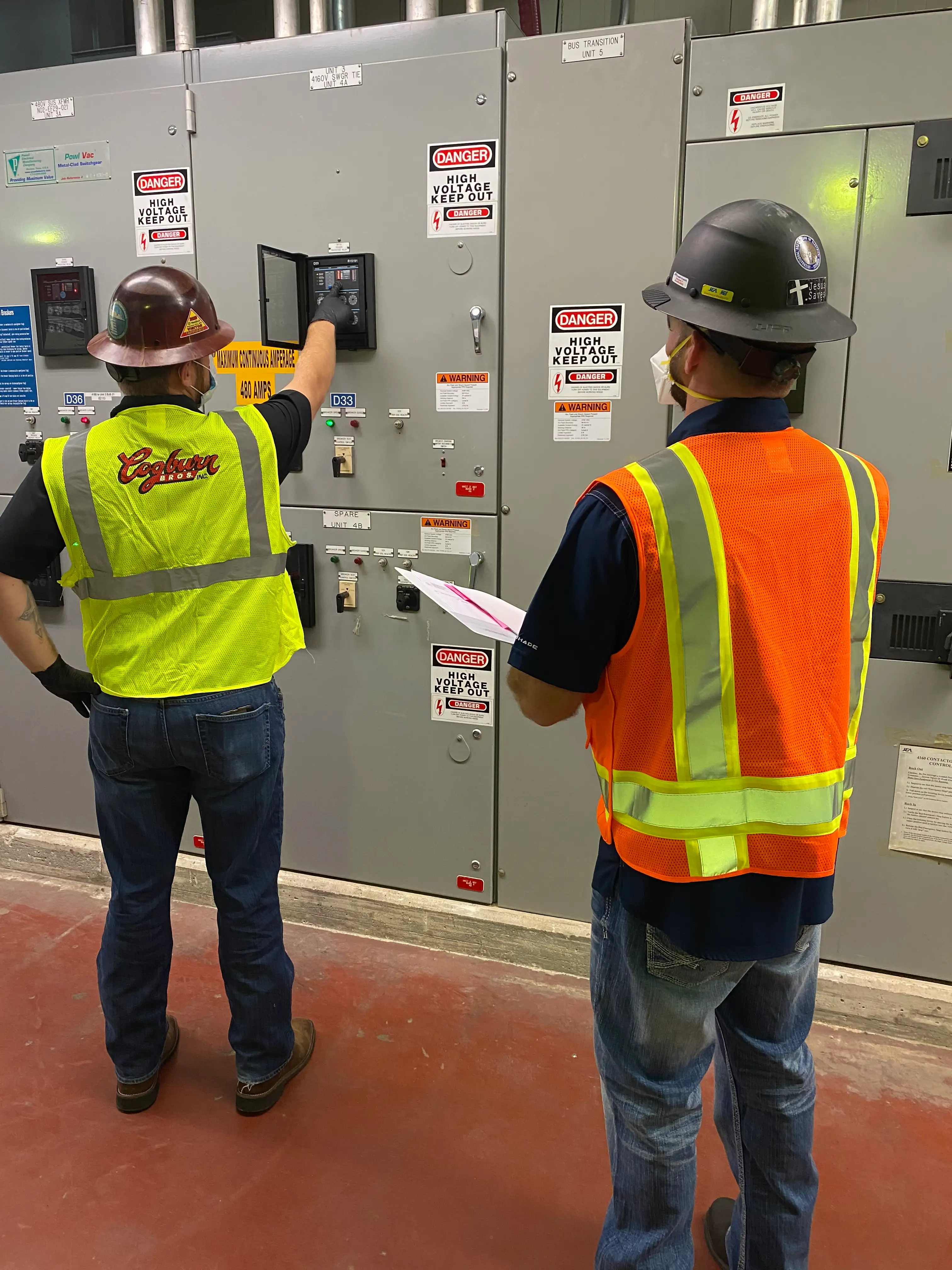 A Cogburn Bros electrician working inside a treatment plant control room
